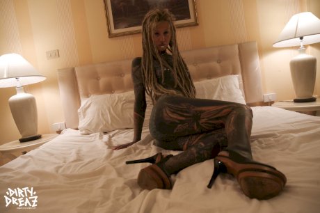 Heavily tattooed girl fists her pussy after masturbating with a sex toy