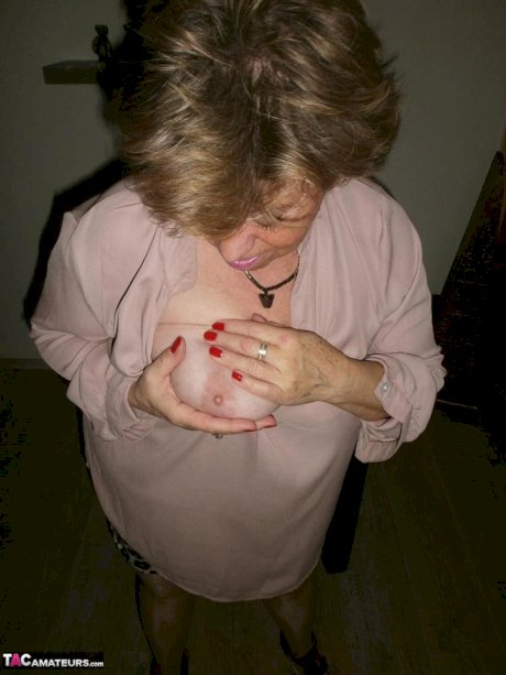Horny old Caro with big saggy tits pinching nipples & peeing in the bathroom