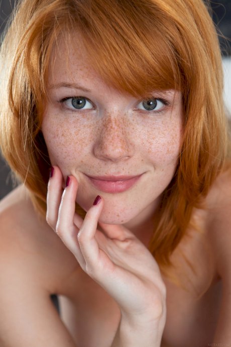 Czech teen Mia Sollis displays her cute freckled face & bald pussy up close