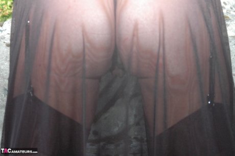 Mature blonde shows her pussy while wearing crotchless underwear in nylons