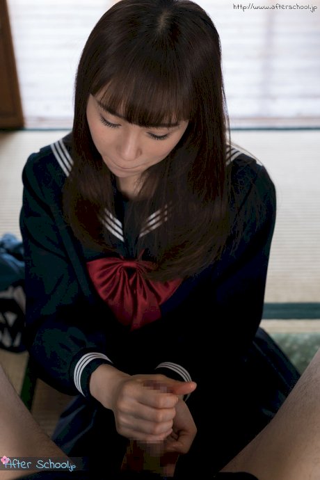 Japanese schoolgirl removes over the knee nylons before giving a footjob