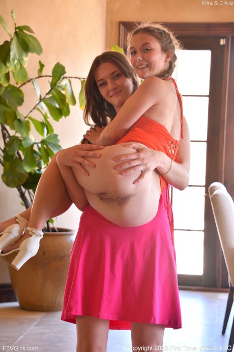 Lesbian girls Olivia Madison and Mira flash in public before sex on a sofa