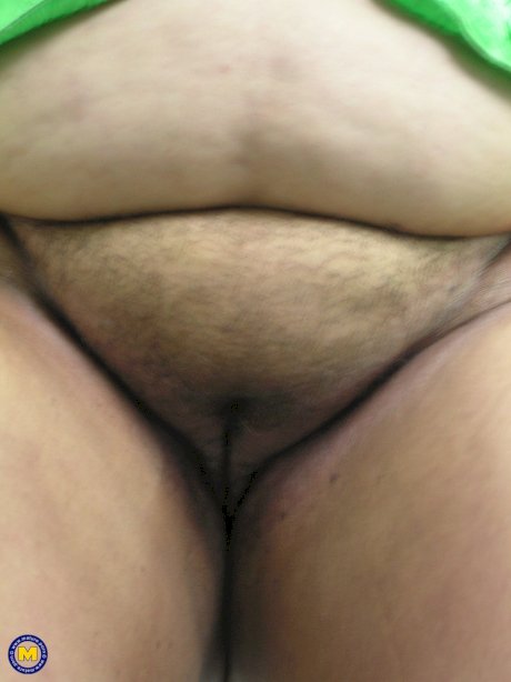 Naughty fat mature Lydia plays with her massive juggs and poses naked
