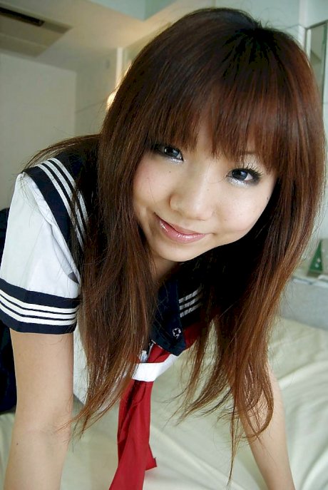 Lovely asian cutie Megumi Kitigawa undressing and spreading her sexy legs