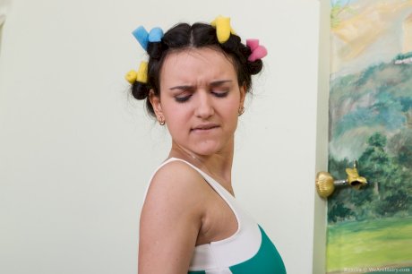 Cute teen Ramira uncovers big natural tits before freeing bush from pantyhose