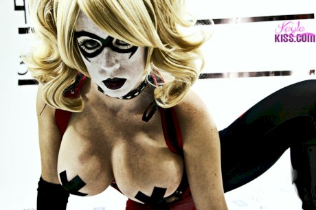 Busty cosplay cutie strips her costume to show her cartoonish proportions