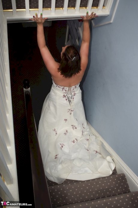 Amateur woman Sara Banks as her tits and pussy freed from a gown by two men