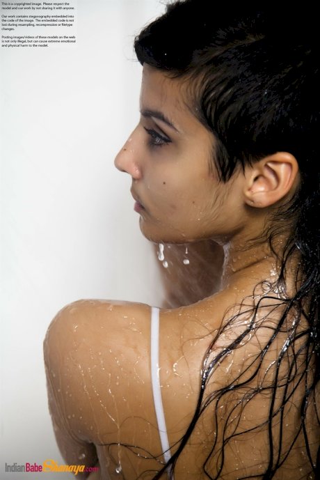 Indian solo girl takes off her wet dress to pose nude in the bathtub