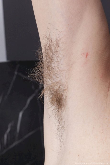 Tall MILF Nimfa Mannay shows off her small saggy tits and her hairy pussy