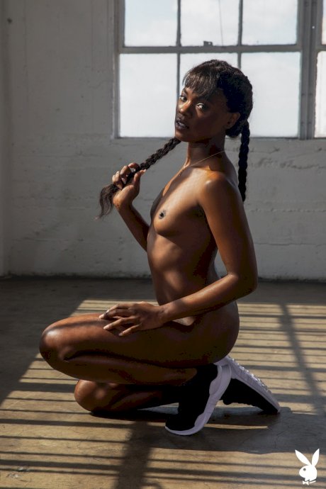 Hot black girl Ana Foxxx touts her phat ass during Playboy centerfold shoot