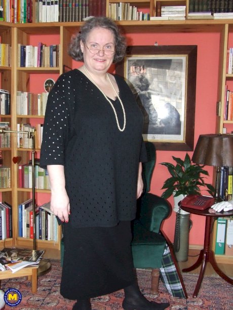 Fat mature woman Birgid strips her clothes & lingerie to show her huge body