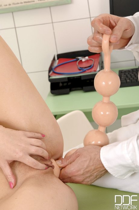 Beautiful French nurse Tiffany Doll gets her beaver toyed by a horny doc
