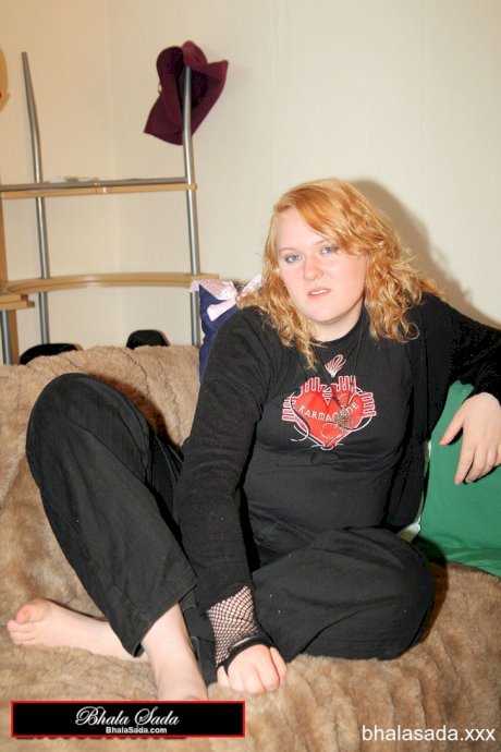 Redheaded fatty strips her sweatshirt and shows her cleavage in a black bra