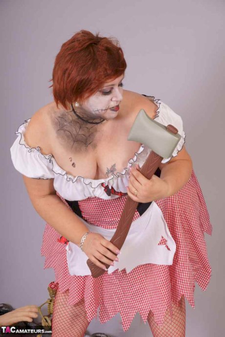 Redheaded BBW Lexie Cummings doffs cosplay wear to pose nude in mesh nylons