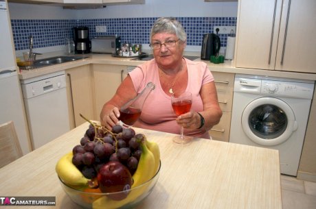 Mature BBW Grandma Libby strips in the kitchen to wine & dine & toy pussy nude