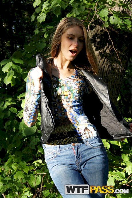 Slim amateur uncovers her small tits in blue jeans during homemade action