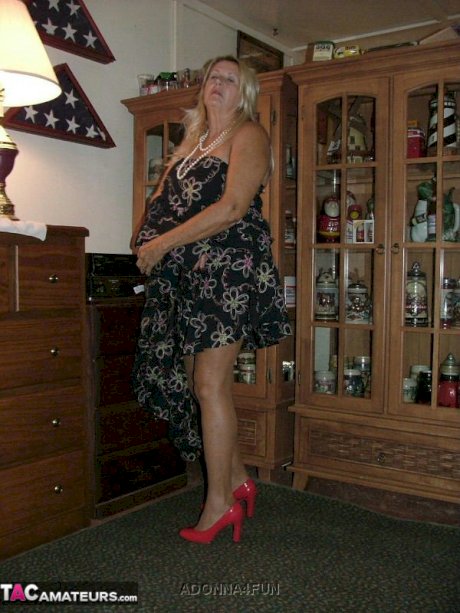 Fat grandmother with blonde hair exposes herself in tan nylons and garters