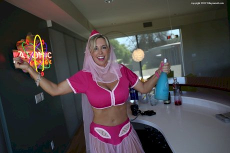 Cute blonde housewife releases her hooters from Jeanie outfit