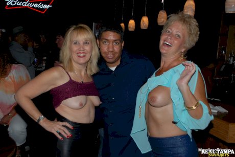 Amateur swinger Tracy Lick and her girls play with horny guys in a night club
