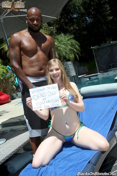 Pale blonde hottie with natural tits Dolly Leigh fools around at the pool