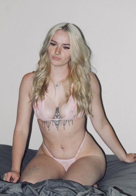 Sexy blonde Blake Bloom posing in her provocative lingerie in a solo