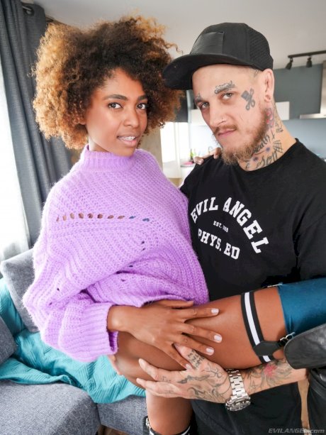 Black teen Luna Corazon sports an afro during sex with an inked white dude