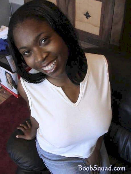 Ebony cutie Carla unveiling her huge natural breasts and round booty