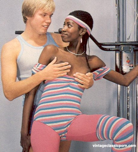 Skinny ebony babe gives a hunky white dude a blowjob in a foursome at the gym