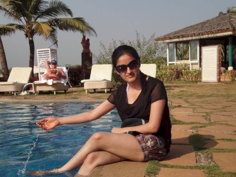 Indian female exposes her big natural tits during candid action at home