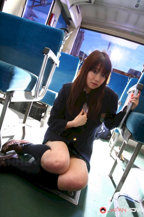 Japanese schoolgirl Yayoi Yoshino is fondled thru her underthings by two men