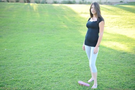 Amateur cutie with glasses Orianna gets naked while doing exercises outdoors