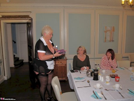 Fat mature maid serves her guests while wearing revealing clothing
