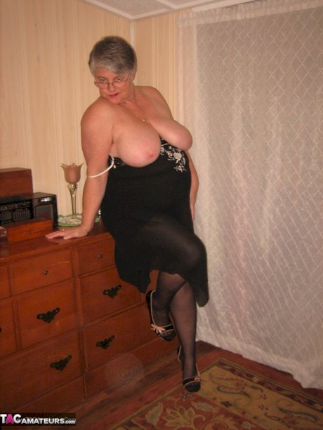 Overweight nan Girdle Goddess strips to her footwear in front of a dresser
