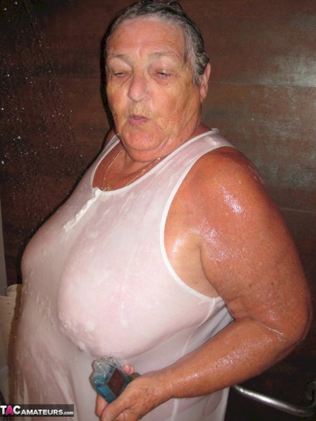 Obese amateur Grandma Libby blow drys her hair after taking a shower