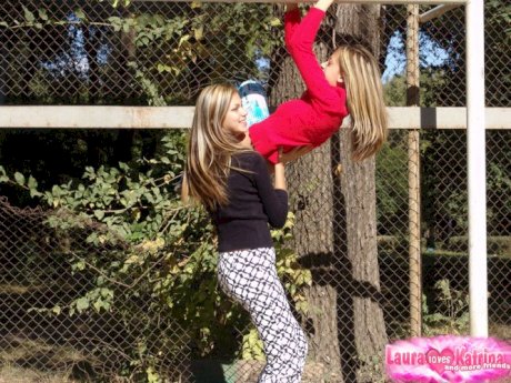 Young hot blonde lesbian teens having fun flashing their small tit in the sun