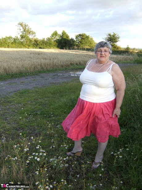 Obese oma Grandma Libby exposes her huge ass while in a field by a rural road