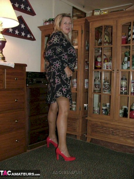 Fat grandmother with blonde hair exposes herself in tan nylons and garters