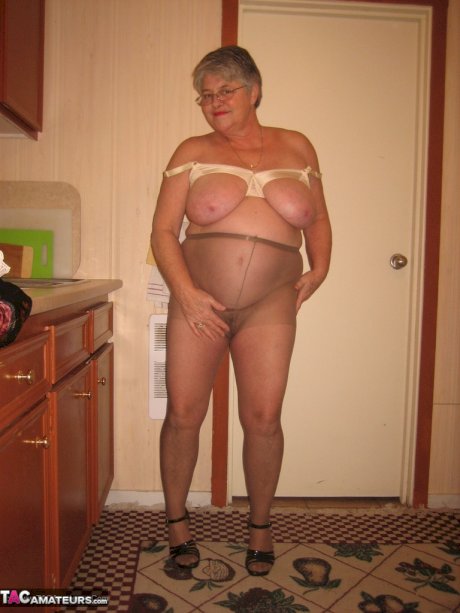 Old woman Girdle Goddess strips to pantyhose in her kitchen