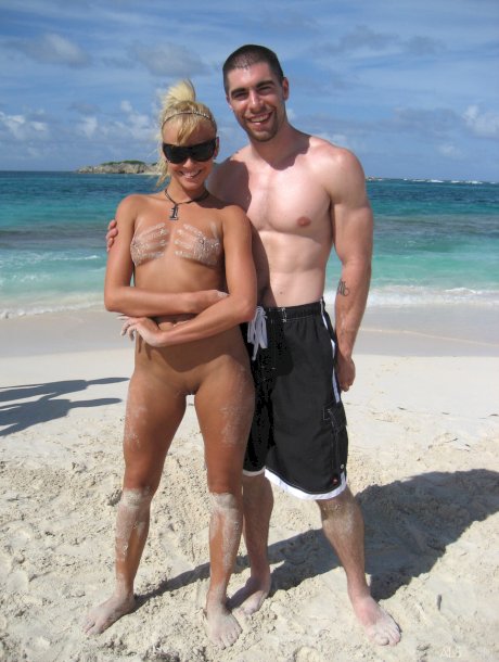 Adorable babe Amy Lee and her blonde friend pose and suck a dick on the beach