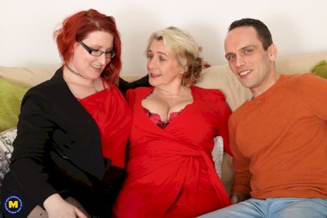 Big boobed ladies Camilla C & Rue Bourbon give a cute stud a double blowjob