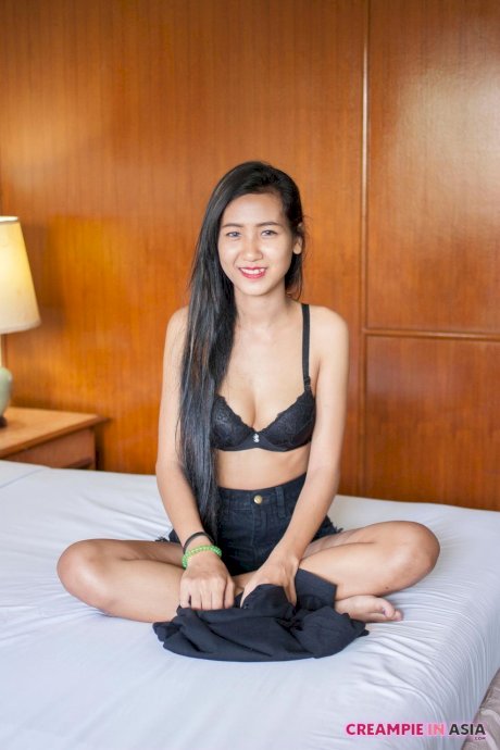 Pretty Asian babe Pop shows her creampied pussy after a hot striptease