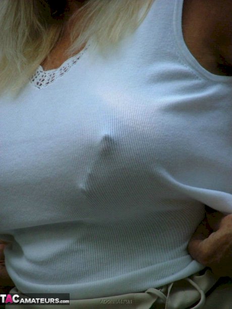 Mature lady Adonna likes torturing her pierced pussy and sexy nipples outdoors