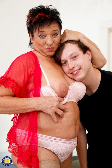 Overweight granny Joanne has sex with her far younger lover atop a bed