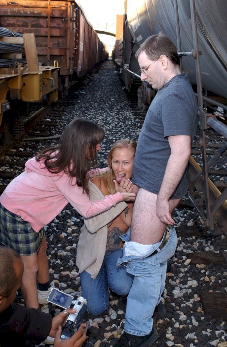 Amateur MILFs Tiger and Vixen suck a nerdy guy's cock in the rail yard
