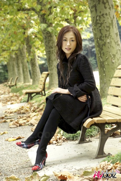Fully clothed Japanese teen models in the park in black clothes and stockings