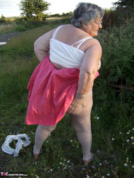 Obese oma Grandma Libby exposes her huge ass while in a field by a rural road