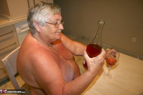 Mature BBW Grandma Libby strips in the kitchen to wine & dine & toy pussy nude