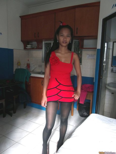 Tiny Filipina Trisha Mae strips to her stockings and spreads her pussy