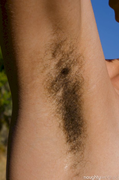 Exotic ebony Kendi Oh unveils her hairy tattooed body in nature