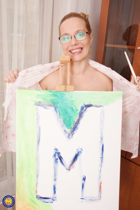 Mature artistic soul Odessa paints her curvy body and pleases herself